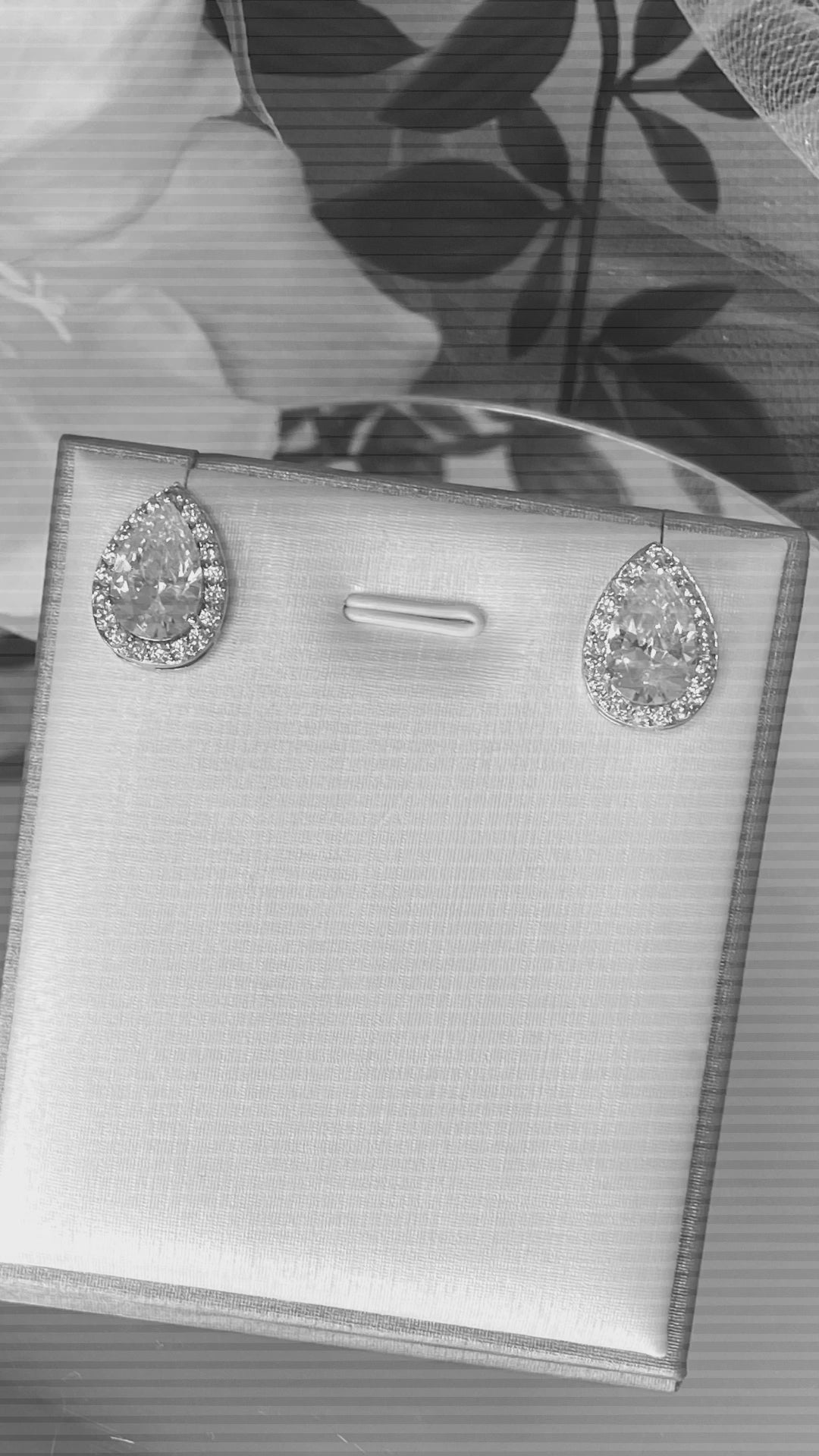 Lizzie Crystal Stud Earrings: Pear and Baguette Elegance.