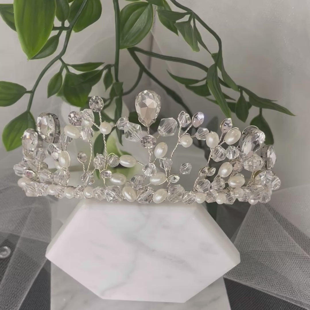 "Amara Tiara: Exquisite Handcrafted Crystal and Pearl Adorned Masterpiece."