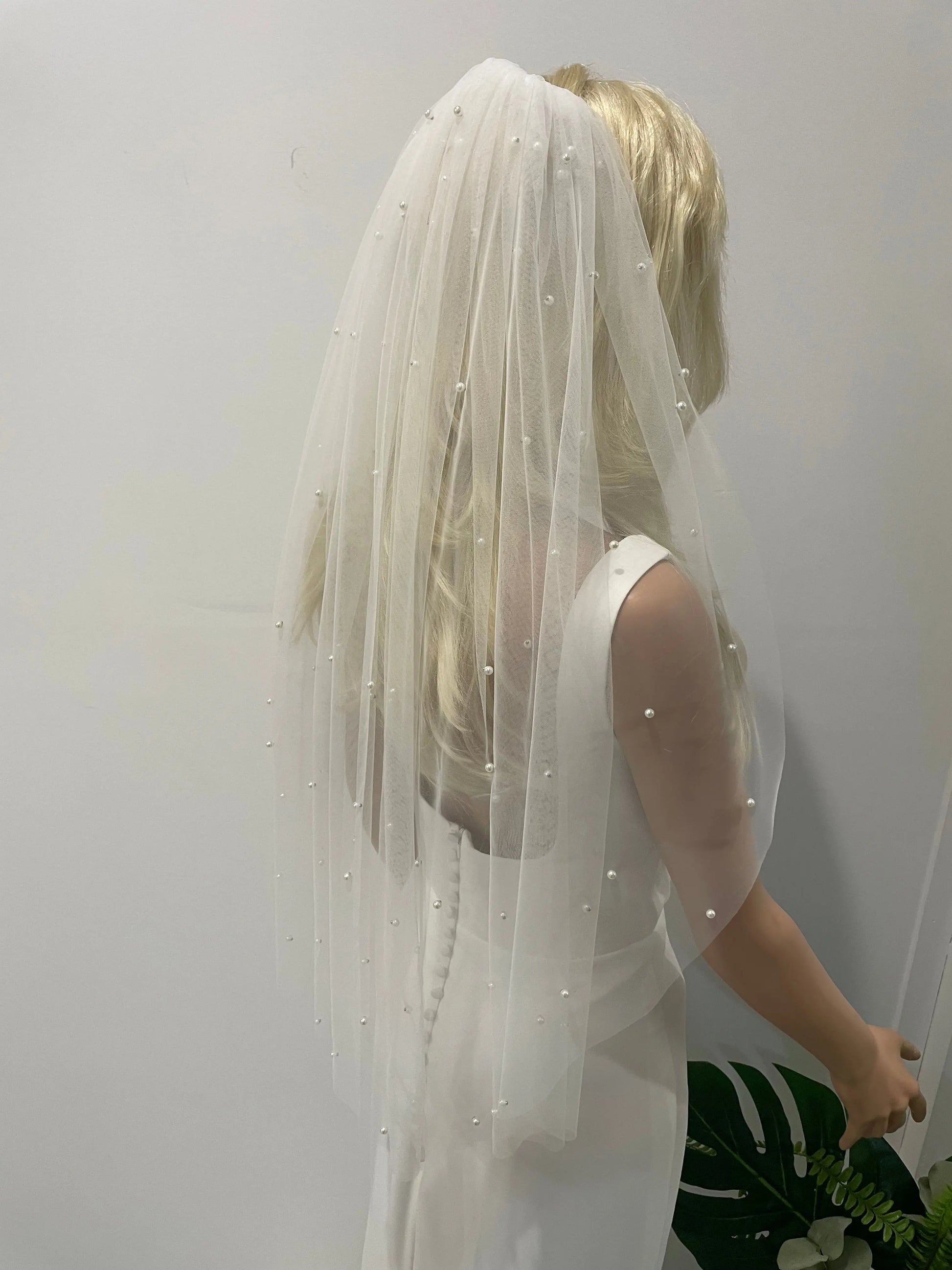 Side view of mini pearl veil with scattered pearls and silver backings