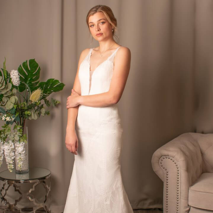 Amelia lace mermaid bridal dress with plunging V-neck by Divine Bridal.