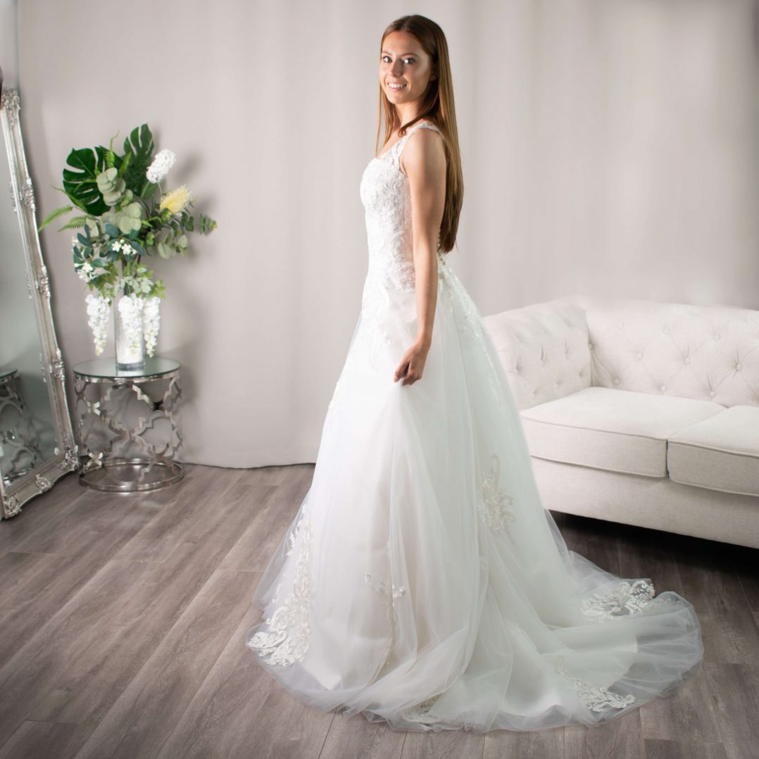 Lucia V-neckline Lace Appliqué Wedding Gown by Divine Bridal.