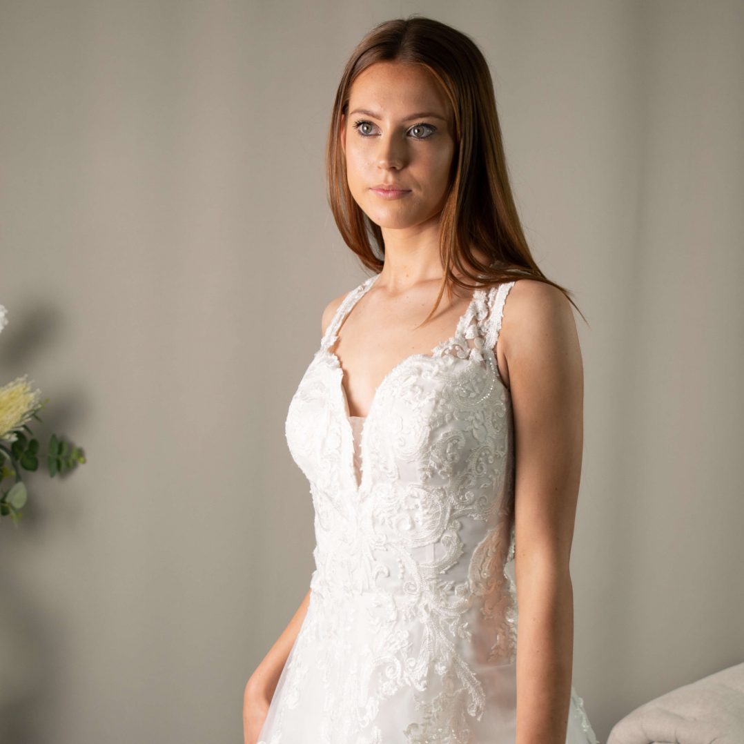 Lucia V-neckline Lace Appliqué Wedding Gown by Divine Bridal.